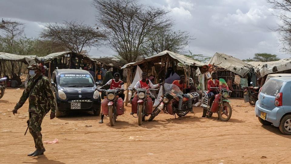 Boda boda (motorcycle taxis) at the exit of the Dagahaley refugee camp food distribution point (Dadaab, Kenya).