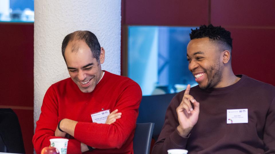 Rodrigo López Barreda (left) and Adam Adou (right) sharing a joke during Research Week 2024.