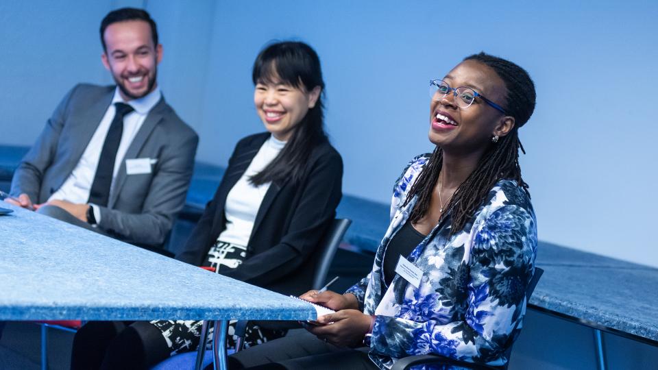 Ruben Tans (conference co-organiser), Ngoc Hân Nguyen and Obaa Akua Konadu-Osei, discussing their work in the panel on ‘Multi-scalar migrant integration’.