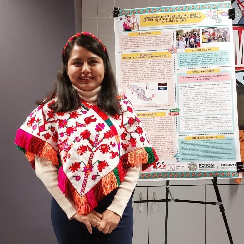 Edna Marlene Martínez Hernández with the poster presentation of her Summer of Science research project.