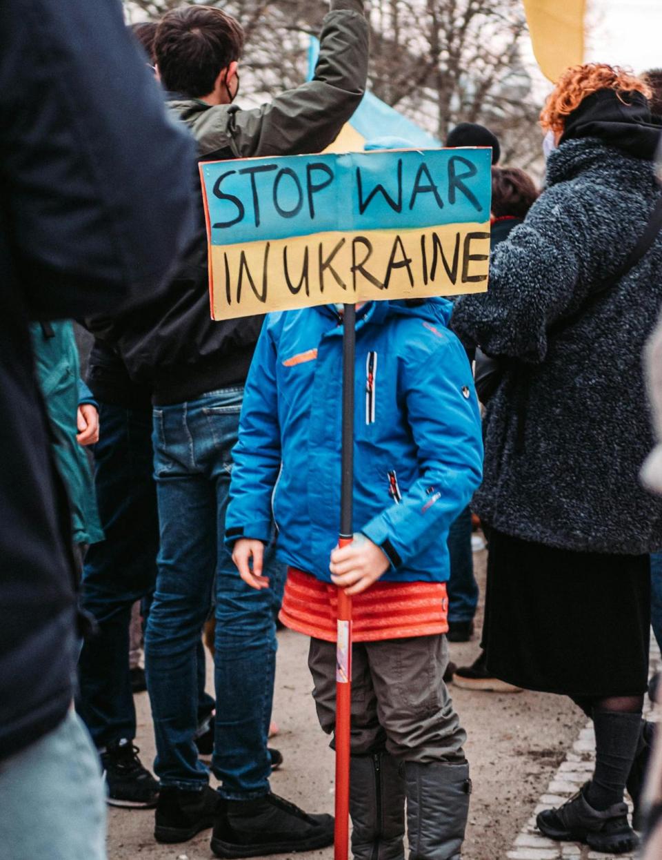 A child protesting the war [Berlin, February 2022]. 