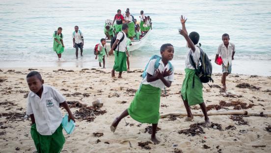 School children in Fiji travel by boat. 