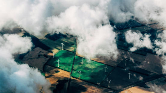Aerial view of a field with wind turbines