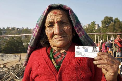 Nepalise woman holds official documentation.