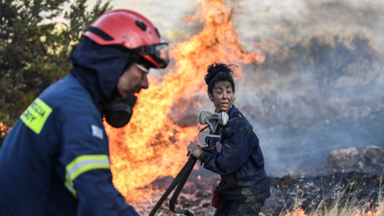 Firefighters work to put out a wildfire in Anavyssos, south of Athens, on September 9, 2020.