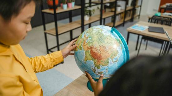 Children with a globe