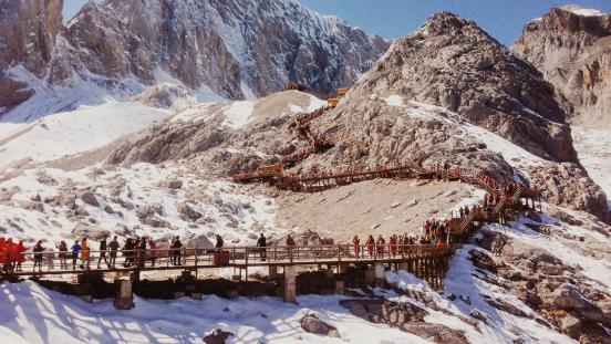 People Climbing Mountains in Lijiang, China 