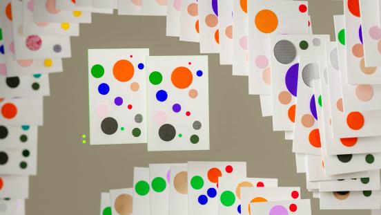 Dynamic display of colorful cards forming an abstract spiral pattern, digitally generated art piece