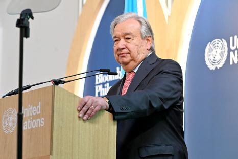 Secretary General from standing at the podium