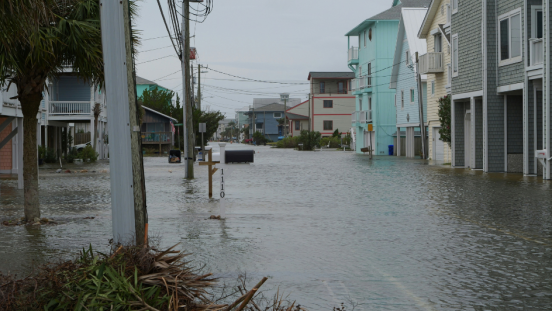 A tidal surge overtakes a town. 