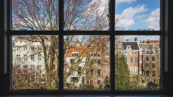 View of residential area of Amsterdam through a window.