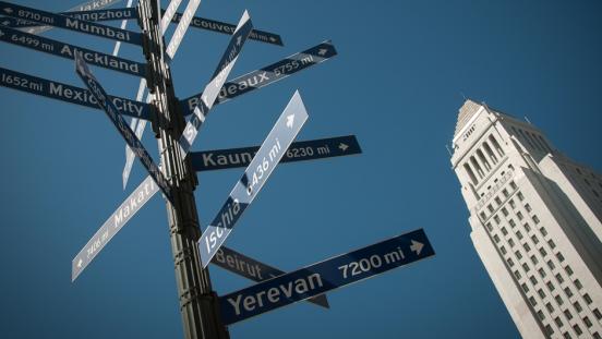 Los Angeles City Hall and a sign post showing its sister cities