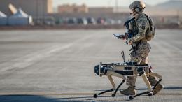 Air Force Tech. Sgt. John Rodiguez patrols with a Ghost Robotics Vision 60 prototype during the Advanced Battle Management System exercise at Nellis Air Force Base, Nev., Sept. 3, 2020.