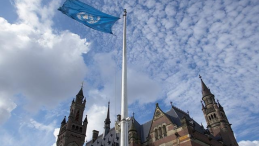 UN flag in front of the International Court of Justice