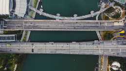 Aerial view of three bridges, one of them being a curved footbridge