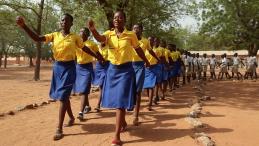 School girls marching to their classrooms after morning assembly, Gbimsi Junior High School, Savelugu, Northern Region, Ghana