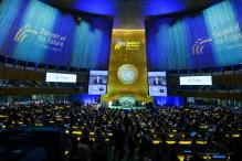 Secretary-General António Guterres (at podium and on screens) addresses the opening of Summit of the Future Action Day Two.