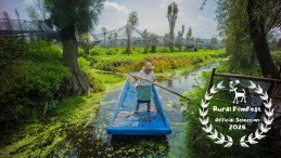 A woman farms the chinampas in Xochimilco, Mexico City on her boat; with the Urban FilmFest laurel