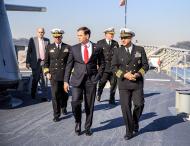 Then-Senator Marco Rubio tours US war ship with US Navy officials