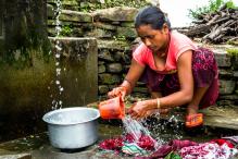A woman washing clothes in Tibet