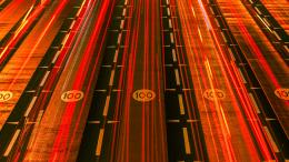 Red car tail light streaks in Dubai