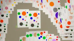 Dynamic display of colorful cards forming an abstract spiral pattern, digitally generated art piece