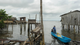A fishermen steers his boat in the aftermath of a storm. 