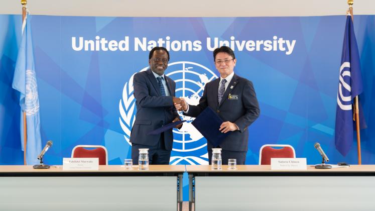 UNU Rector Tshilidzi Marwala and Naha City Mayor Satoru Chinen shake hands after signing a new MoU between UNU and Naha City, Okinawa, Japan. 
