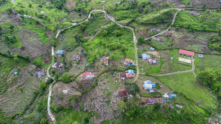 Aerial view: the school building, community houses, and agroforestry land area along the road rehabilitation in Batumanu, Timor-Leste