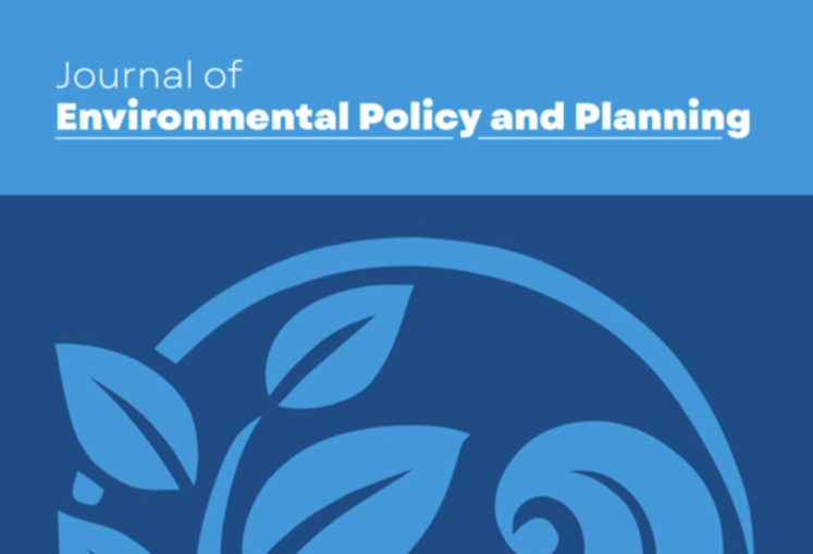 Photo of Journal of Environmental Policy & Planning which depicts a wave and leaf graphic in sky blue over a navy blue background