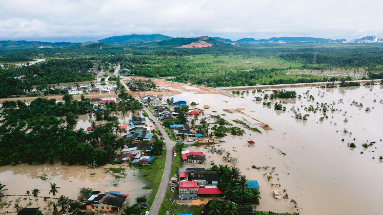 A flooded village in a tropical setting. 