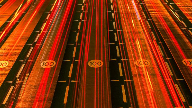 Red car tail light streaks in Dubai