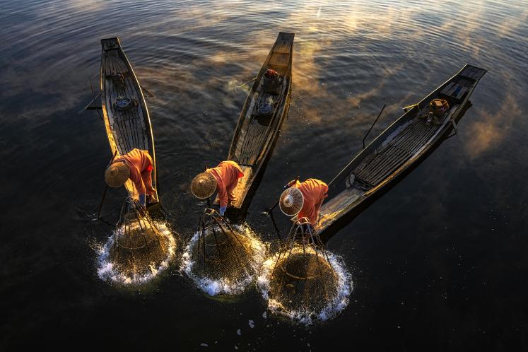Three fishers in Myanmar