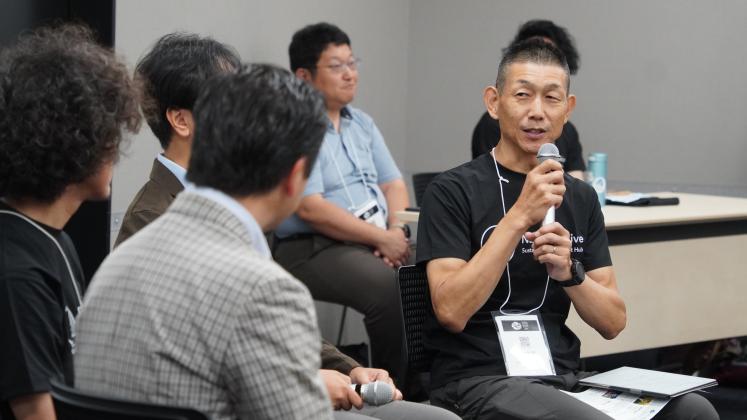 photo of man holding microphone