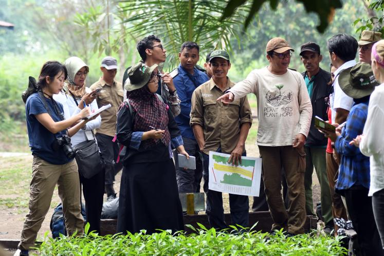 Group of People Talking About Peatlands in Indonesia
