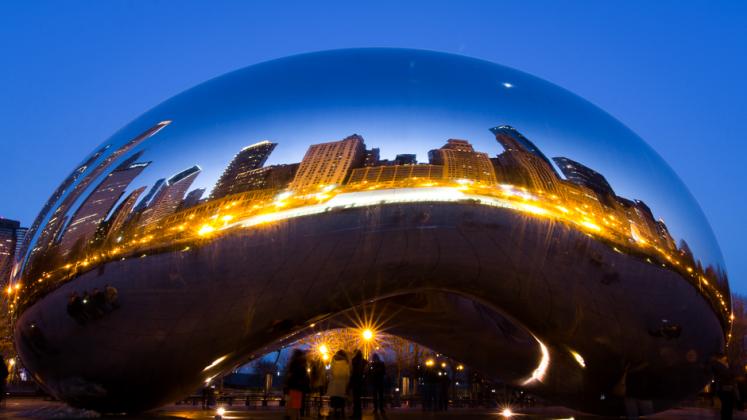 Chicago's "Bean" reflects the city's skyline at dusk